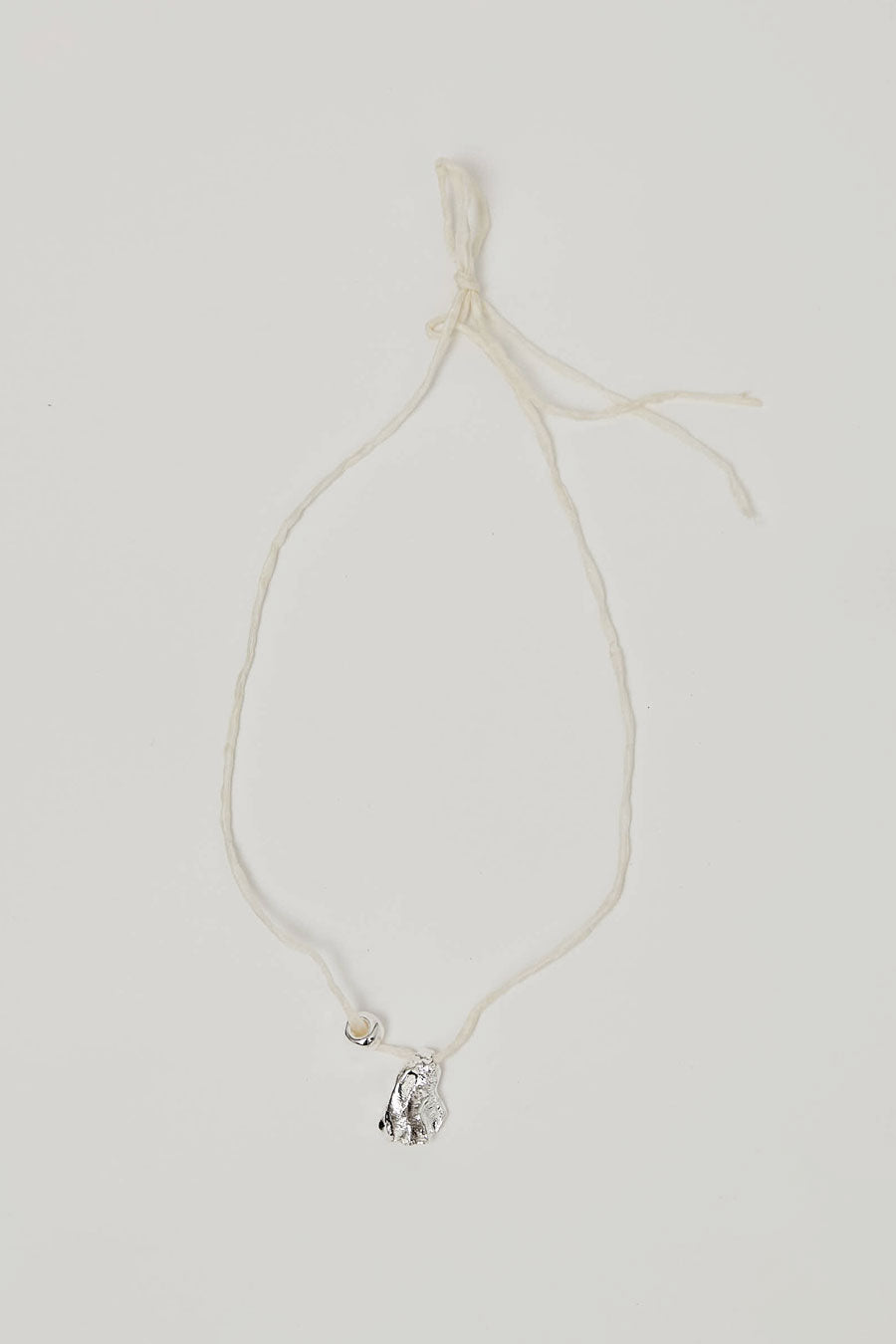Wolf Circus Maya Necklace in Silver on Cream Cord